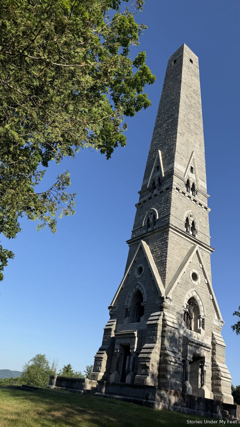 The Saratoga Monument, a 155-foot obelisk against the evening sky